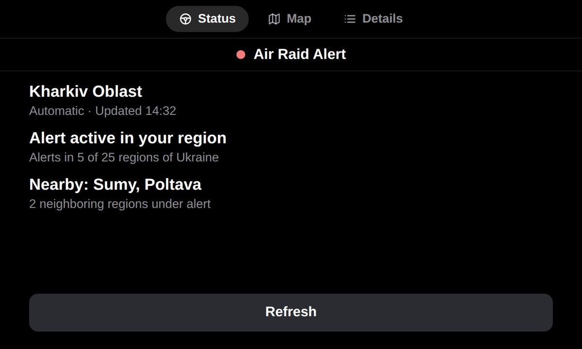 DriveCheckUA CarPlay status screen design with an air raid alert for Kharkiv Oblast